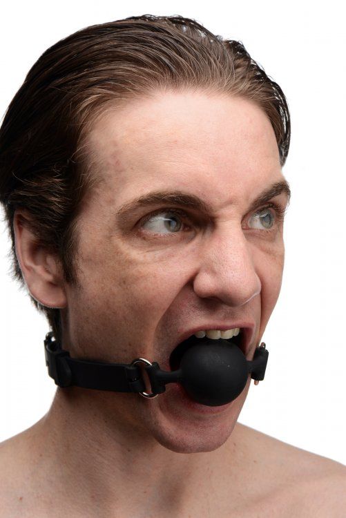 This erotically shaped gag features a penis mouth piece with... Master Series - Suppressor Silicone Face Banger Gag - Black photo-2
