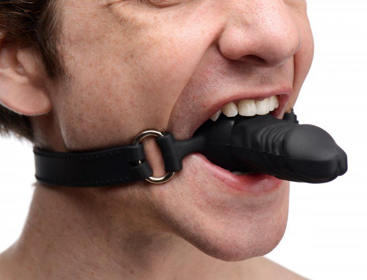 This erotically shaped gag features a penis mouth piece with... Master Series - Suppressor Silicone Face Banger Gag - Black photo-3
