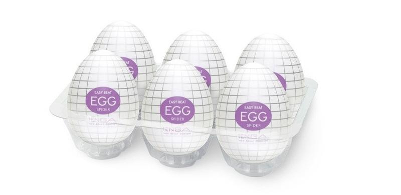 Enclosed within is a detailed web structure, covering the en... Tenga - Egg Spider photo-10